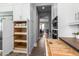 Kitchen with pull-out pantry shelves and drawer organizers, offering practical storage solutions for a well-organized space at 10511 E Diffraction Ave, Mesa, AZ 85212