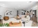 Spacious living room showcasing modern decor, a plush sectional, and an open layout with seamless kitchen access at 10511 E Diffraction Ave, Mesa, AZ 85212