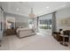 Spacious main bedroom features a large window and an elegant chandelier at 10511 E Diffraction Ave, Mesa, AZ 85212