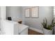 A home office is complete with a built-in desk, neutral tones, and modern decor at 10511 E Diffraction Ave, Mesa, AZ 85212