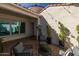 Outdoor patio with comfortable seating, lush greenery, and string lighting for a relaxing atmosphere at 10511 E Diffraction Ave, Mesa, AZ 85212