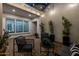 Charming outdoor patio with stylish seating, potted plants, and ambient string lighting at 10511 E Diffraction Ave, Mesa, AZ 85212