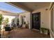 Inviting outdoor patio featuring stylish seating and charming string lights for a relaxing ambiance at 10511 E Diffraction Ave, Mesa, AZ 85212
