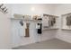 Walk-in closet features custom shelving and rods for optimal organization and storage at 10511 E Diffraction Ave, Mesa, AZ 85212