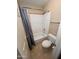 Bathroom with shower and tub, toilet, and tiled floors at 1053 E Sunburst Ln, Tempe, AZ 85284