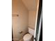 Compact half-bathroom featuring a toilet and towel rack at 1053 E Sunburst Ln, Tempe, AZ 85284