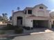 Inviting two-story home featuring a stucco facade, covered parking, and desert landscaping at 1053 E Sunburst Ln, Tempe, AZ 85284