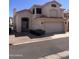 Charming two-story home with a well-maintained front yard, two-car garage, and a red tile roof at 1053 E Sunburst Ln, Tempe, AZ 85284