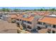 This exterior shot showcases the building's architectural style with red tile roof and private balconies at 11666 N 28Th Dr # 152, Phoenix, AZ 85029