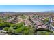 Expansive aerial view of a residential community with lush green golf courses and well-maintained homes in a desert setting at 12439 W Yellow Bird Ln, Peoria, AZ 85383