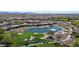 This aerial shows the lush golf course and pond surrounded by beautiful homes in this scenic community at 12439 W Yellow Bird Ln, Peoria, AZ 85383