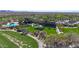 Expansive aerial view of a resort-style community with a pool, clubhouse, and lush landscaping, offering a luxurious lifestyle at 12439 W Yellow Bird Ln, Peoria, AZ 85383