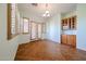 Dining room featuring tile floors, shuttered windows, and a built-in cabinet at 12439 W Yellow Bird Ln, Peoria, AZ 85383