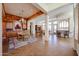 Expansive open-concept dining room with natural light and decorative columns at 12439 W Yellow Bird Ln, Peoria, AZ 85383