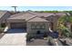 Charming home with a tile roof, desert landscaping, and a two-car garage at 12439 W Yellow Bird Ln, Peoria, AZ 85383
