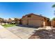 Lovely home showcasing a three-car garage and mature landscaping at 12749 W Sheridan St, Avondale, AZ 85392