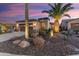Charming single-story home featuring desert landscaping, neutral color palette, and a two-car garage at 13065 W Lucia Dr, Peoria, AZ 85383