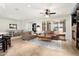Bright living room with tile floors, modern furniture, and ample natural light at 13065 W Lucia Dr, Peoria, AZ 85383