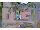 Aerial view of estate with pool and mountain views, highlighting the layout, landscaping, and location at 13627 E Monument Dr, Scottsdale, AZ 85262