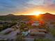 Stunning desert home boasts a pool, outdoor kitchen, and captivating sunset views at 13627 E Monument Dr, Scottsdale, AZ 85262