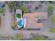 A bird's eye view of the property showcasing its custom pool and extensive desert landscaping at 13627 E Monument Dr, Scottsdale, AZ 85262
