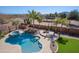 Overhead shot displays the pool, spa, lush landscaping, and privacy of the backyard at 13627 E Monument Dr, Scottsdale, AZ 85262