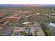 Expansive desert community showcases custom homes and stunning mountain views at sunset at 13627 E Monument Dr, Scottsdale, AZ 85262