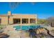 Inviting backyard oasis with a refreshing pool, spa and desert landscaping at 13627 E Monument Dr, Scottsdale, AZ 85262