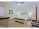 Charming bedroom with stylish furniture, plush bedding, and plenty of natural light at 13627 E Monument Dr, Scottsdale, AZ 85262