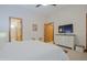 Comfortable bedroom with bright, neutral tones and ensuite bathroom and walk in closet at 13627 E Monument Dr, Scottsdale, AZ 85262