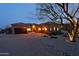 Beautiful home exterior showcasing a well-manicured front yard with desert landscaping and a paved driveway at 13627 E Monument Dr, Scottsdale, AZ 85262
