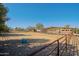 Horse property featuring stalls, shelters, and space to roam with desert landscape at 13627 E Monument Dr, Scottsdale, AZ 85262