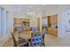 Open kitchen and dining area featuring wood cabinets, stainless appliances, and stylish chandelier at 13627 E Monument Dr, Scottsdale, AZ 85262
