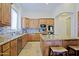 Well-appointed kitchen with custom cabinetry, granite countertops, and stainless steel appliances at 13627 E Monument Dr, Scottsdale, AZ 85262