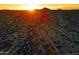 Desert landscape view with a dirt trail and sunset at 13627 E Monument Dr, Scottsdale, AZ 85262