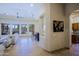 Living room with neutral palette, wet bar, and view to outdoor pool area at 13627 E Monument Dr, Scottsdale, AZ 85262