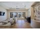 Open concept living room with tray ceilings, bar area, and large windows offering great views at 13627 E Monument Dr, Scottsdale, AZ 85262