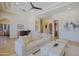 Bright living room with stone floors, wet bar, high ceilings and neutral decor at 13627 E Monument Dr, Scottsdale, AZ 85262