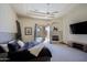 Main bedroom featuring a fireplace and access to the outdoor pool area at 13627 E Monument Dr, Scottsdale, AZ 85262