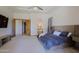 Spacious main bedroom featuring a luxurious bed and seamless access to the en-suite bathroom at 13627 E Monument Dr, Scottsdale, AZ 85262