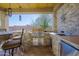 A well-equipped outdoor kitchen boasts stainless steel appliances, stone counters, and ample prep space at 13627 E Monument Dr, Scottsdale, AZ 85262