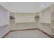 A spacious walk-in closet with custom built-in shelving and ample storage space at 13627 E Monument Dr, Scottsdale, AZ 85262