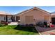 Lovely backyard features a small patio, grass, a barbecue, and perimeter block fencing at 1428 W Mesquite Ave, Apache Junction, AZ 85120