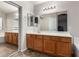 Bathroom featuring large vanity with double mirrors and lighting at 1428 W Mesquite Ave, Apache Junction, AZ 85120