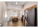 Cozy breakfast nook featuring a ceiling fan and stainless steel refrigerator at 1428 W Mesquite Ave, Apache Junction, AZ 85120