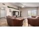 Inviting living room featuring a large television and sliding glass door access to outdoors at 1428 W Mesquite Ave, Apache Junction, AZ 85120