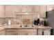 The kitchen features stone countertops, stainless steel appliances, and ample cabinet space at 15050 N Thompson Peak Pkwy # 1035, Scottsdale, AZ 85260