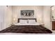 Comfortable main bedroom features soft lighting and a decorative headboard at 15050 N Thompson Peak Pkwy # 1035, Scottsdale, AZ 85260