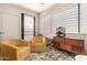Stylish sitting area with mid-century modern furniture, unique decor, and a bright window at 15050 N Thompson Peak Pkwy # 1035, Scottsdale, AZ 85260