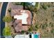 Aerial view showcases the unique architecture and roofline of the home, complete with a sparkling pool at 15106 E Miravista --, Fountain Hills, AZ 85268
